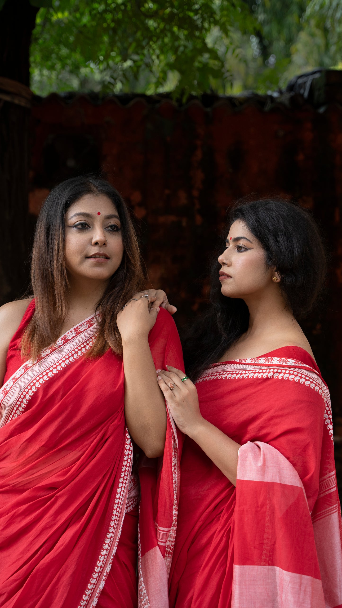 Devii Saree – Red handcrafted saree with lotus & paisley border, honoring everyday women