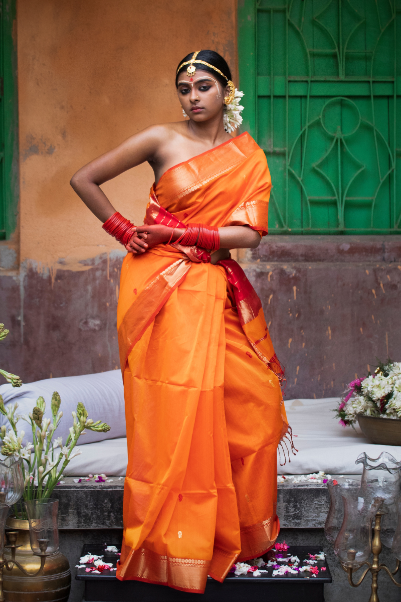 Kesariya - Indiestore Orange Handloom Maheshwari Saree with Golden Red Border
