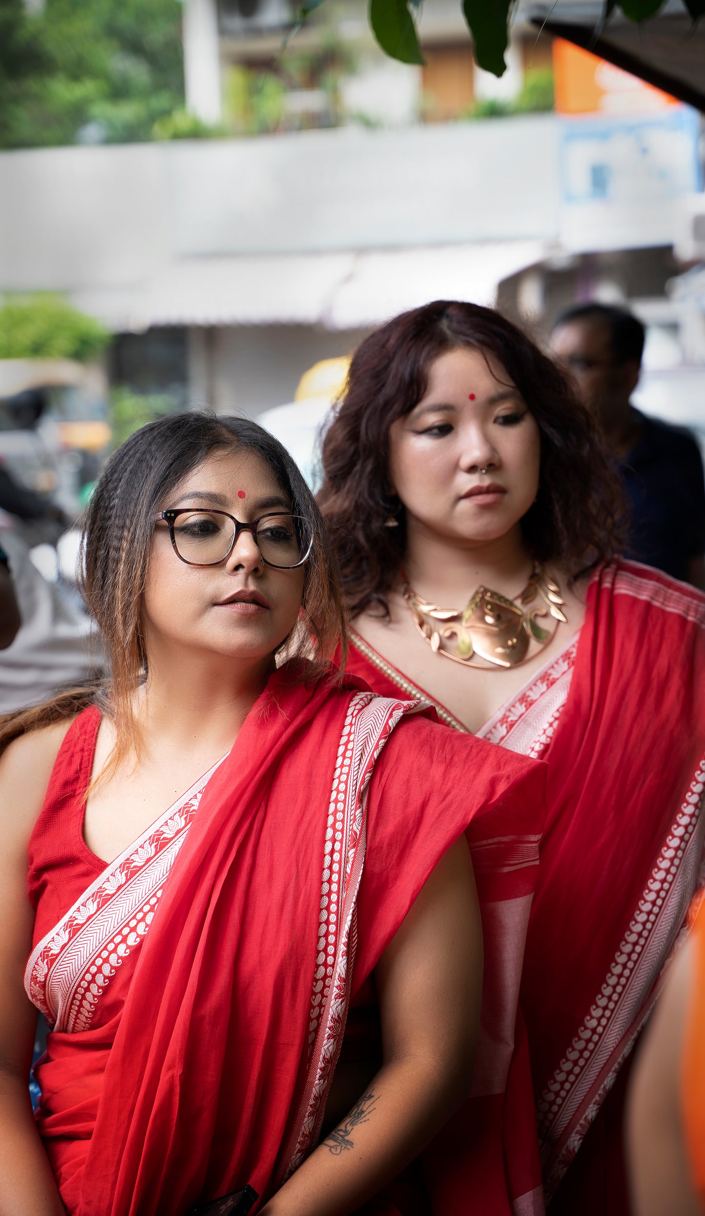 Devii Saree – Red handcrafted saree with lotus & paisley border, honoring everyday women
