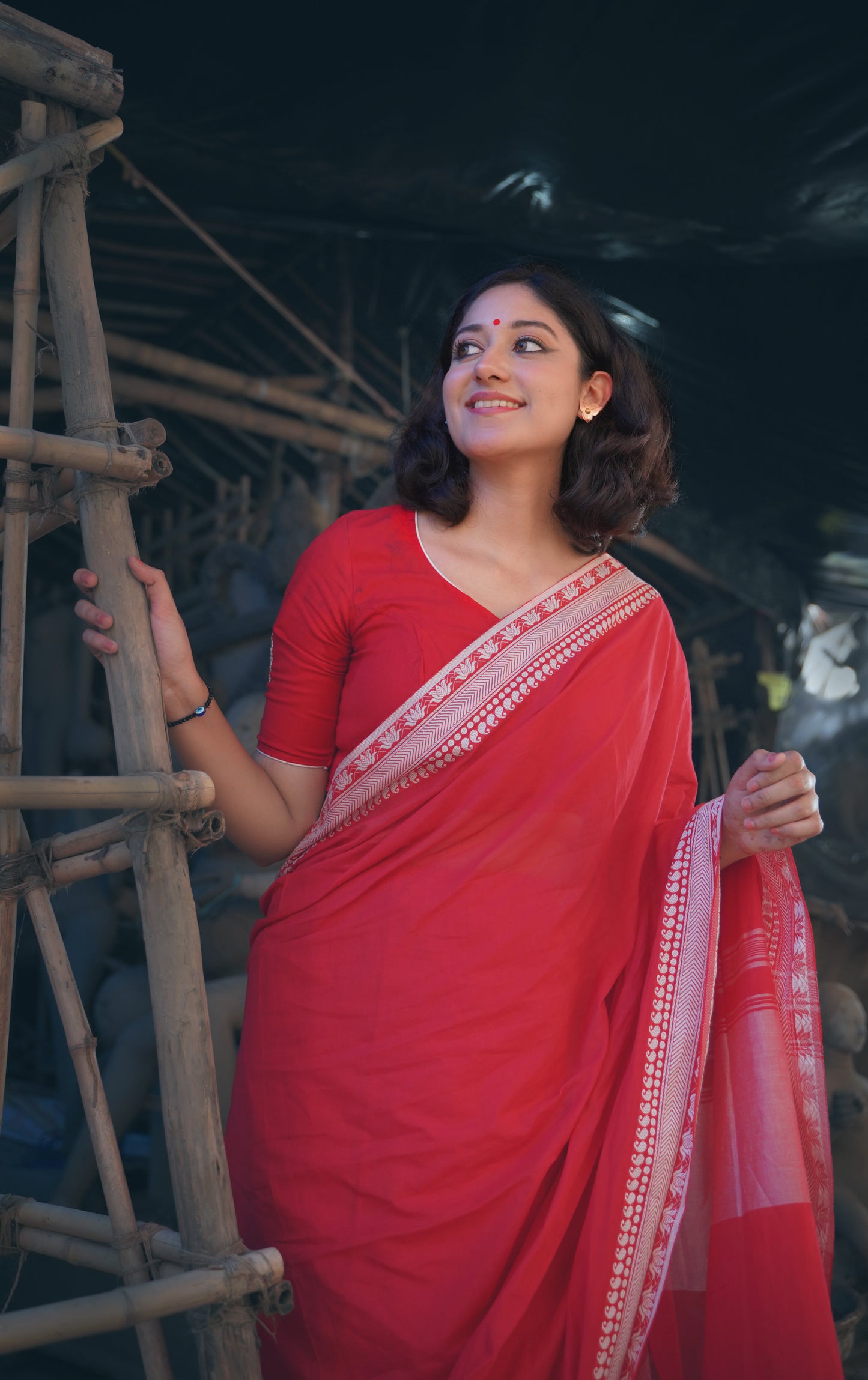 Devii Saree – Red handcrafted saree with lotus & paisley border, honoring everyday women