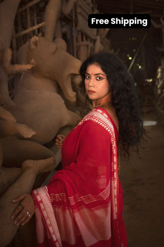 Devii Saree – Red handcrafted saree with lotus & paisley border, honoring everyday women