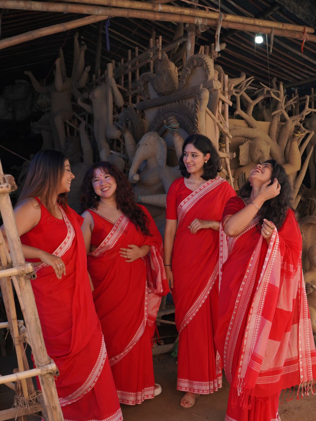 Devii Saree – Red handcrafted saree with lotus & paisley border, honoring everyday women